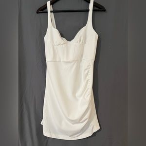A white dress that can we used for graduation or a formal event!! Size medium